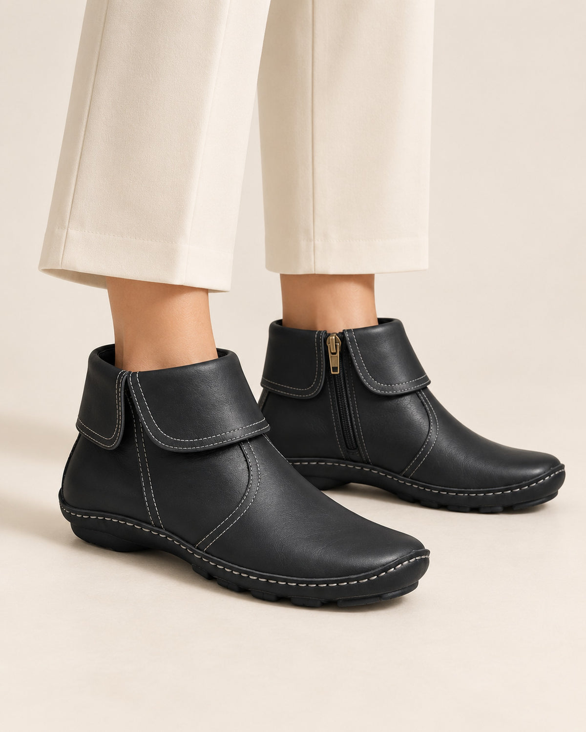 Margaux fold-over cuff ankle boot with side zip in Black, worn