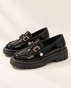 Bérénice patent-finish platform loafer with horsebit buckle in Black, side view