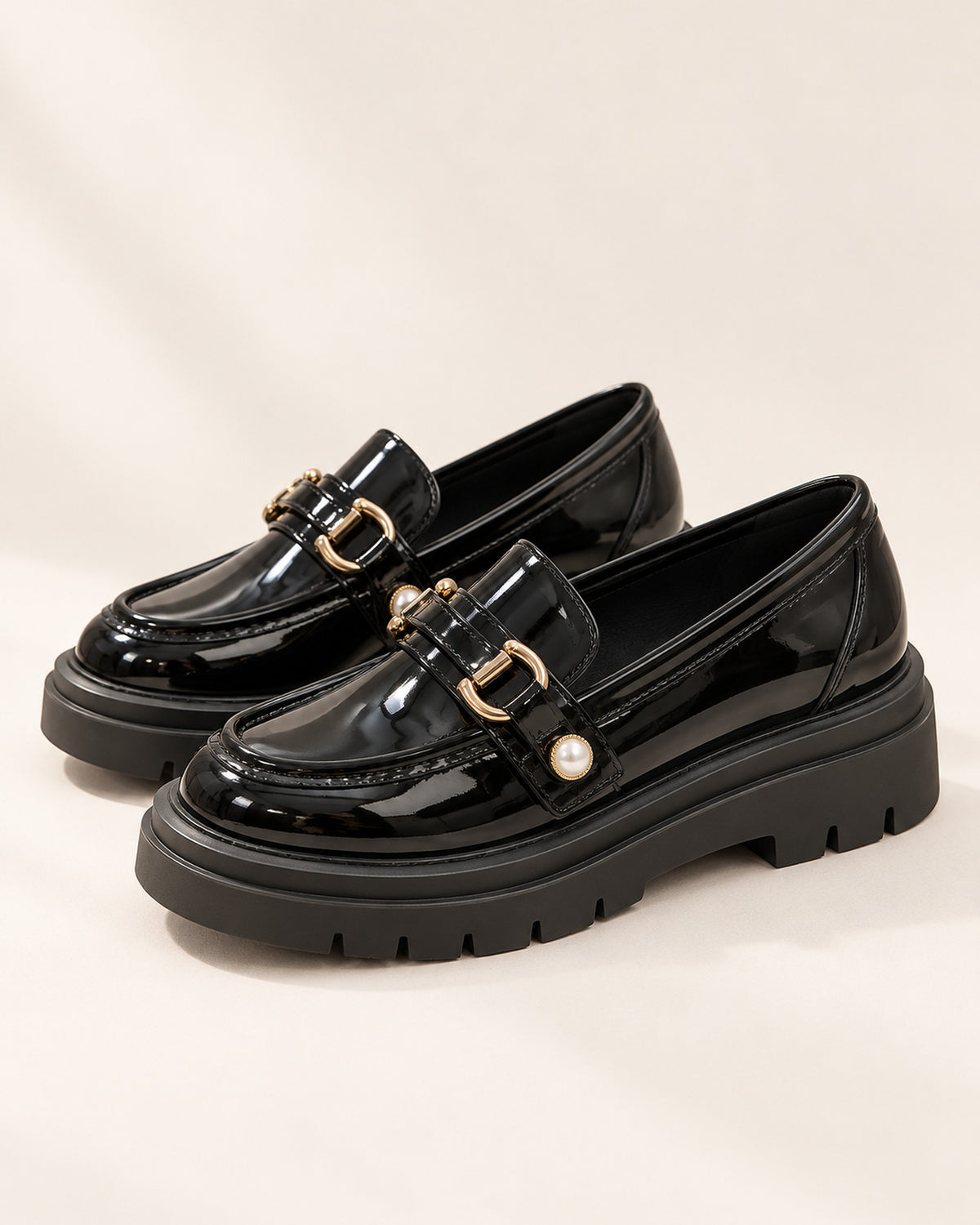 Bérénice patent-finish platform loafer with horsebit buckle in Black, side view