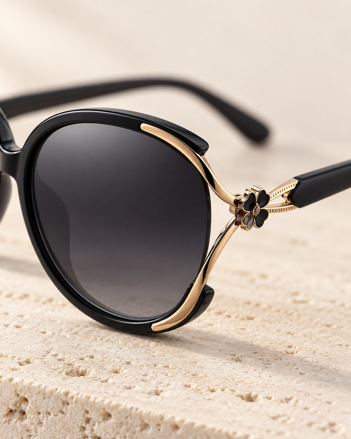 Chiara cat-eye sunglasses in black frame, gray gradient lenses, close-up detail