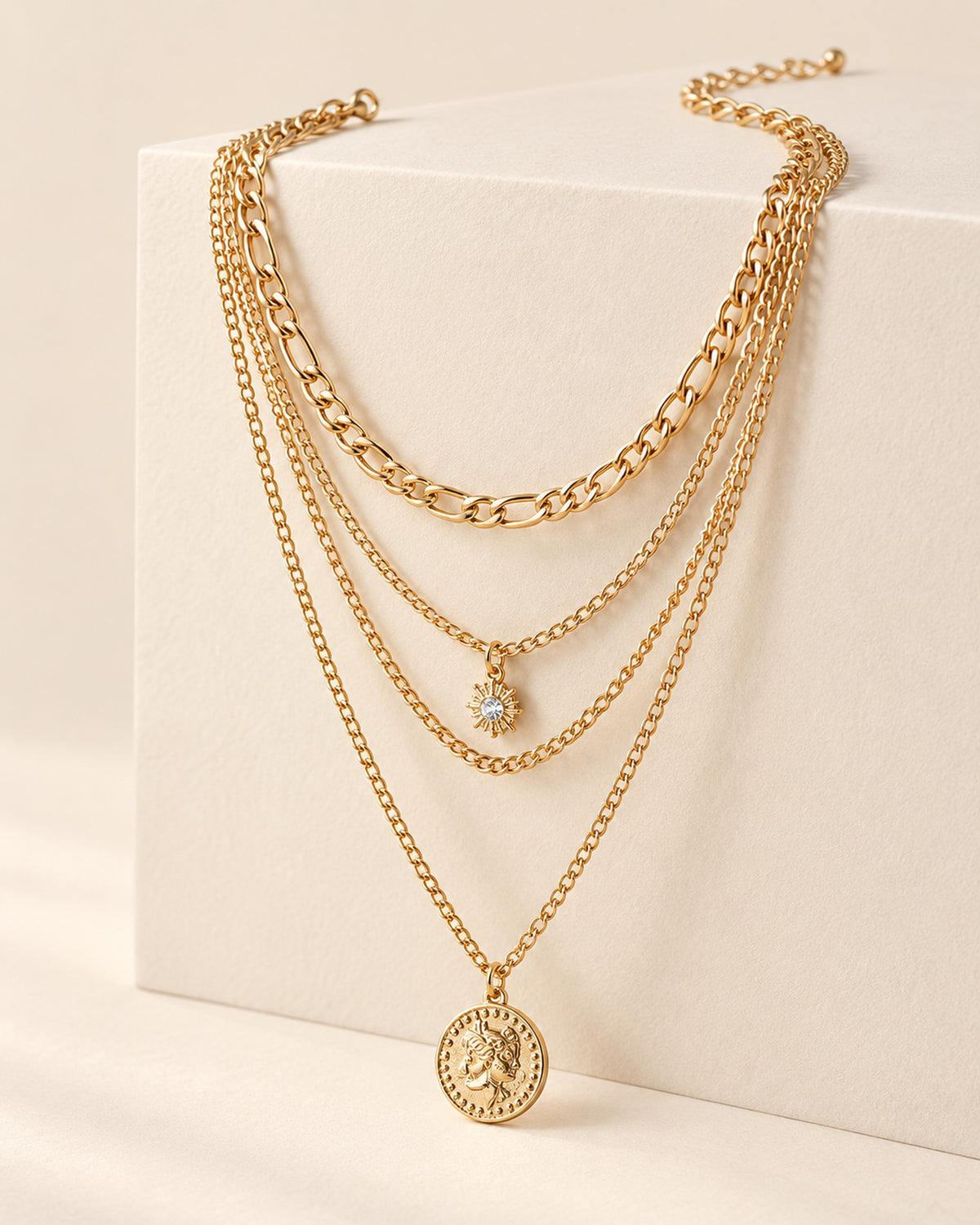 Colette four-strand layered necklace with sun charm and coin medallion in Gold, side view