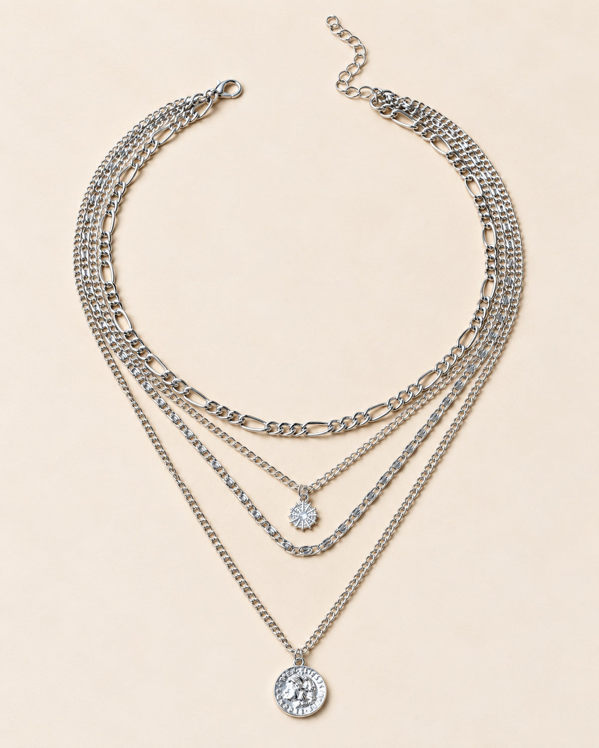 Colette four-strand layered necklace with sun charm and coin medallion in Silver, three-quarter view