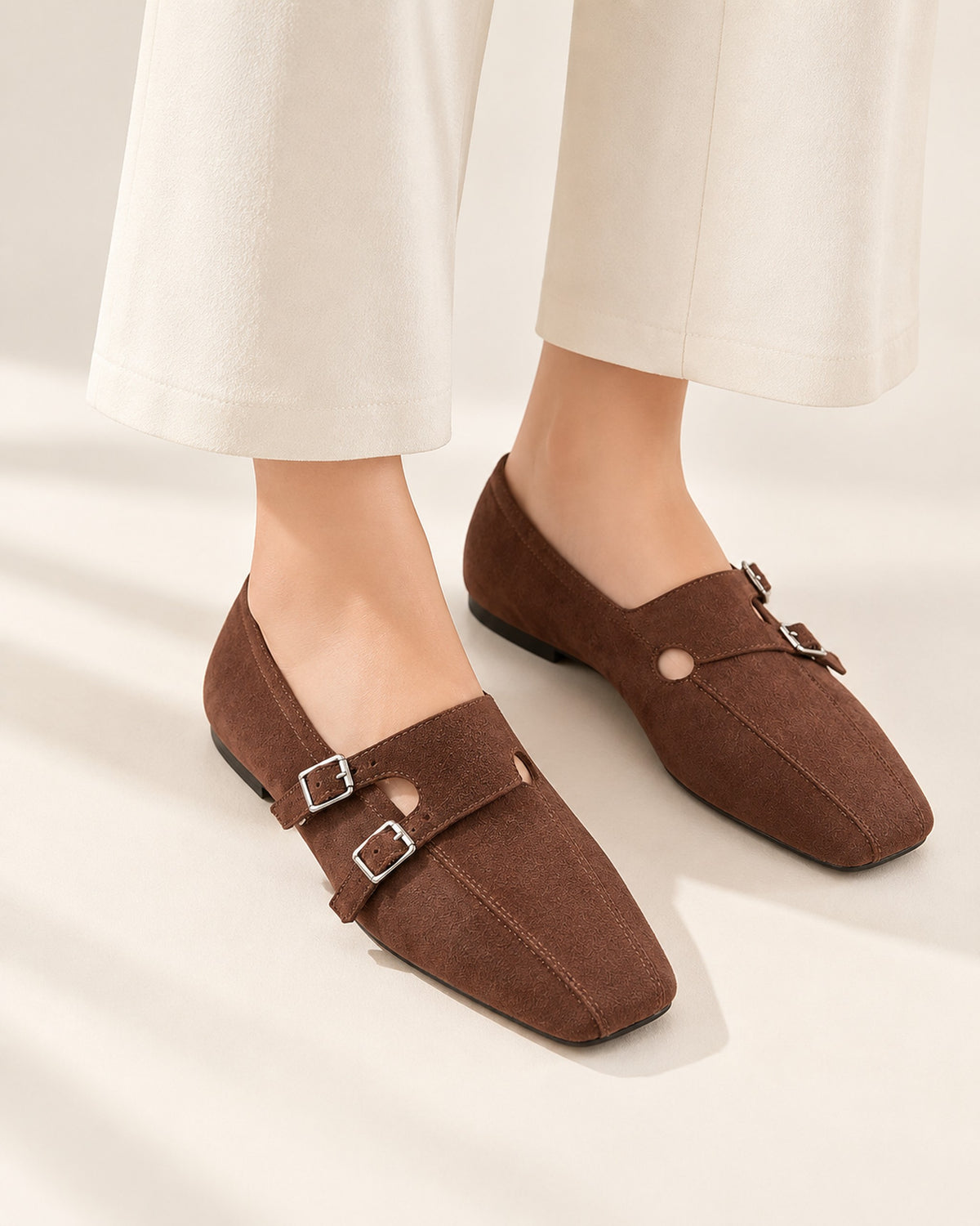 Clémence cow suede double-buckle Mary Jane flat in Brown, worn