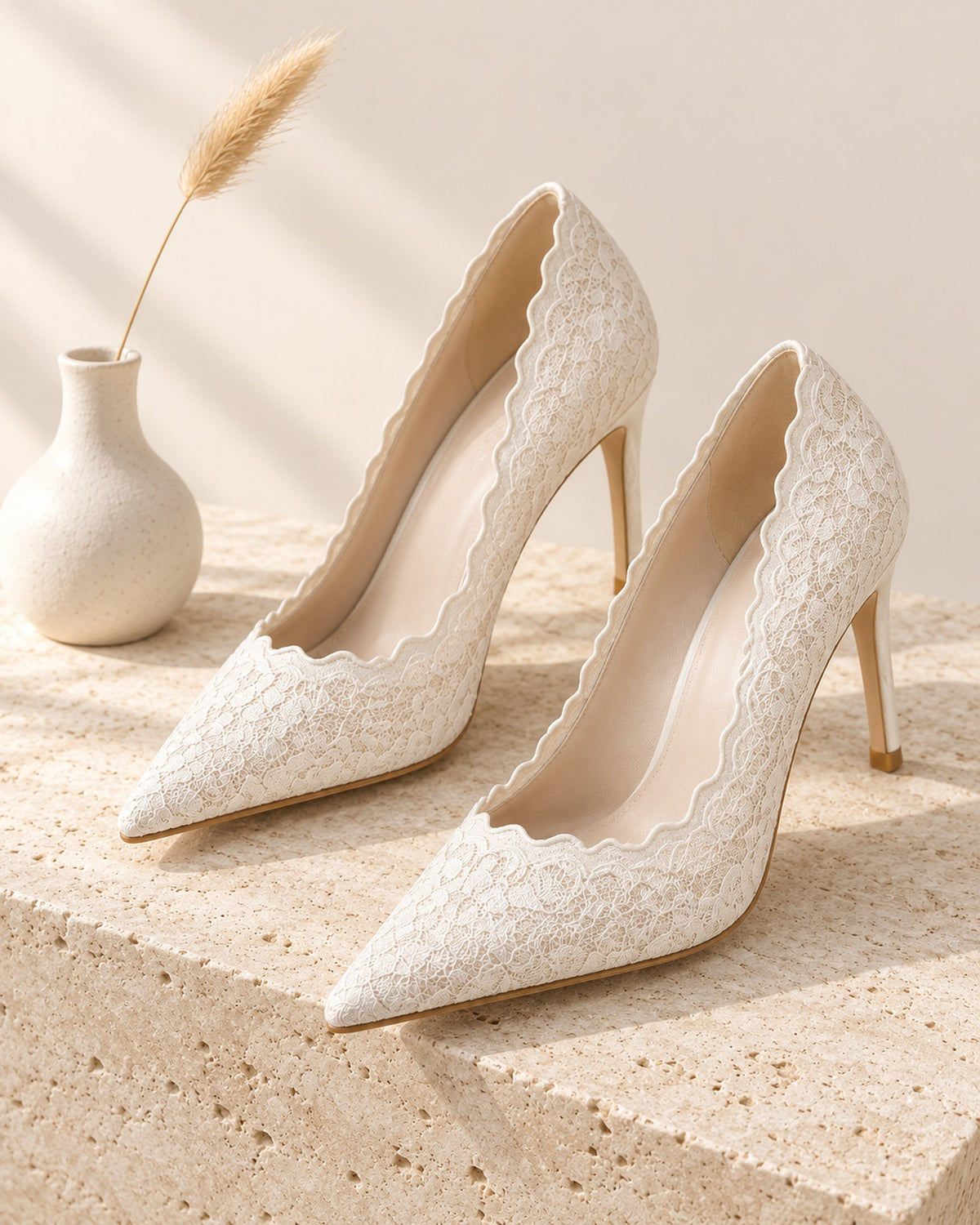 Valérie lace pointed-toe stiletto pump in Beige, still life on travertine