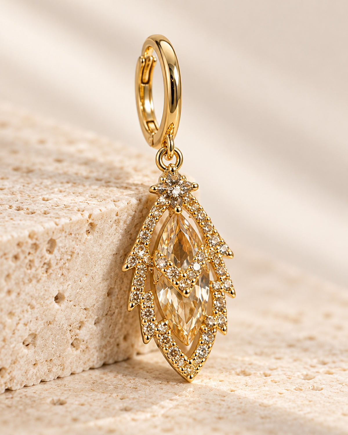 Iris zircon leaf drop earrings on gold-tone huggie hoops in Gold, close-up detail