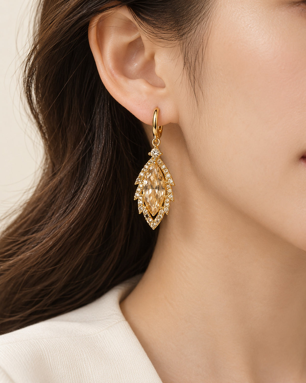 Iris zircon leaf drop earrings on gold-tone huggie hoops in Gold, worn