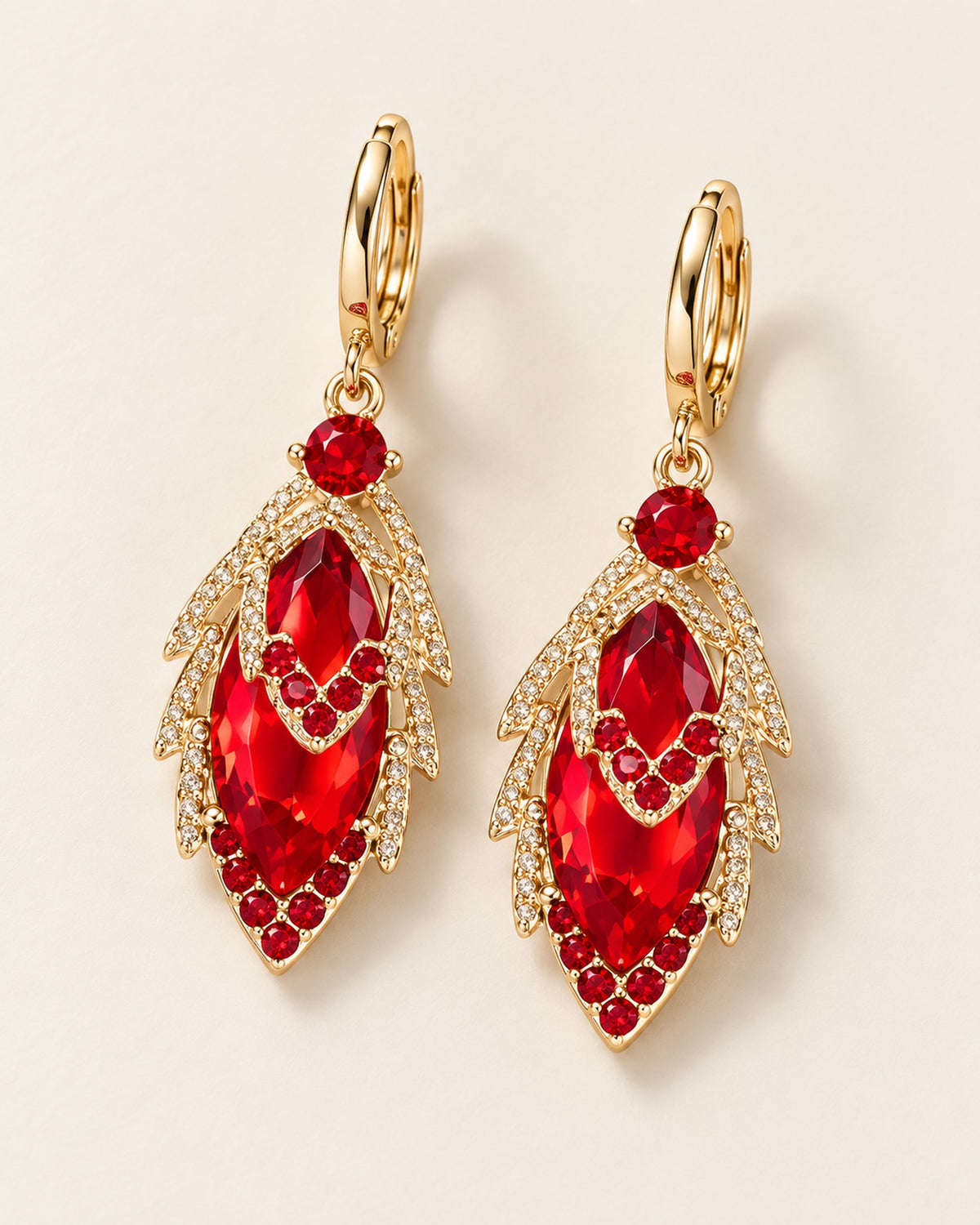 Iris zircon leaf drop earrings on gold-tone huggie hoops in Red, three-quarter view