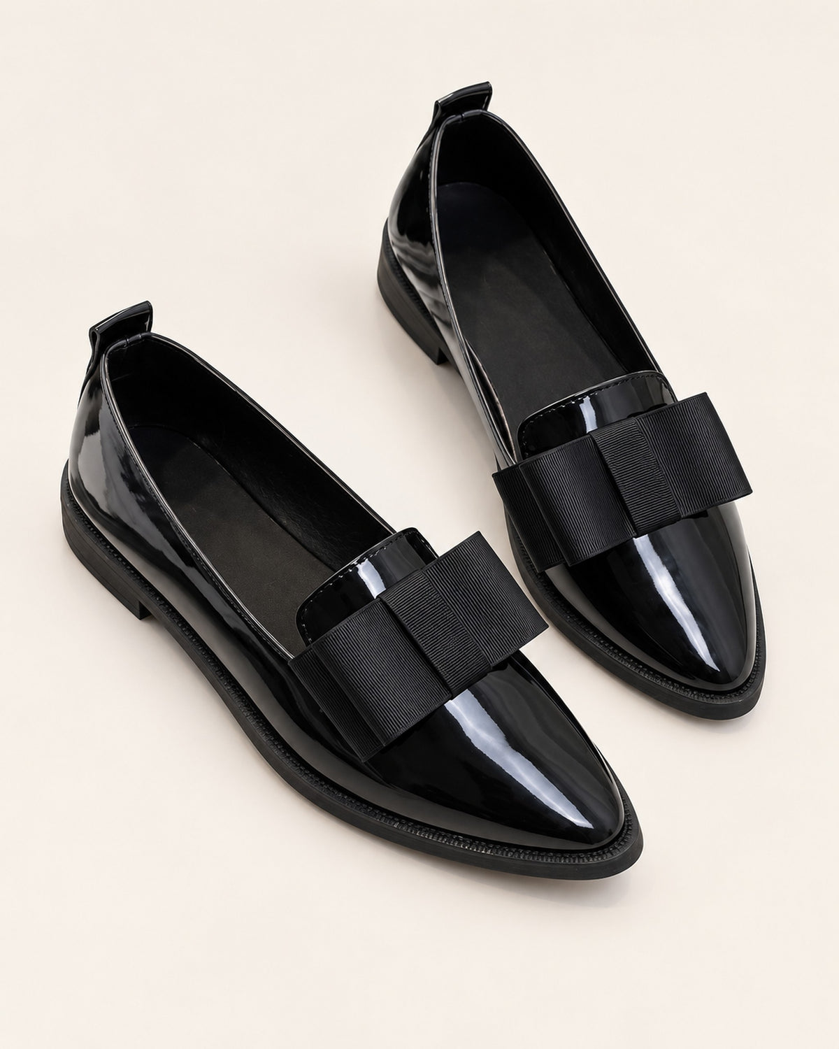 Léa patent-finish pointed ballet flat with oversized bow in Black, three-quarter view