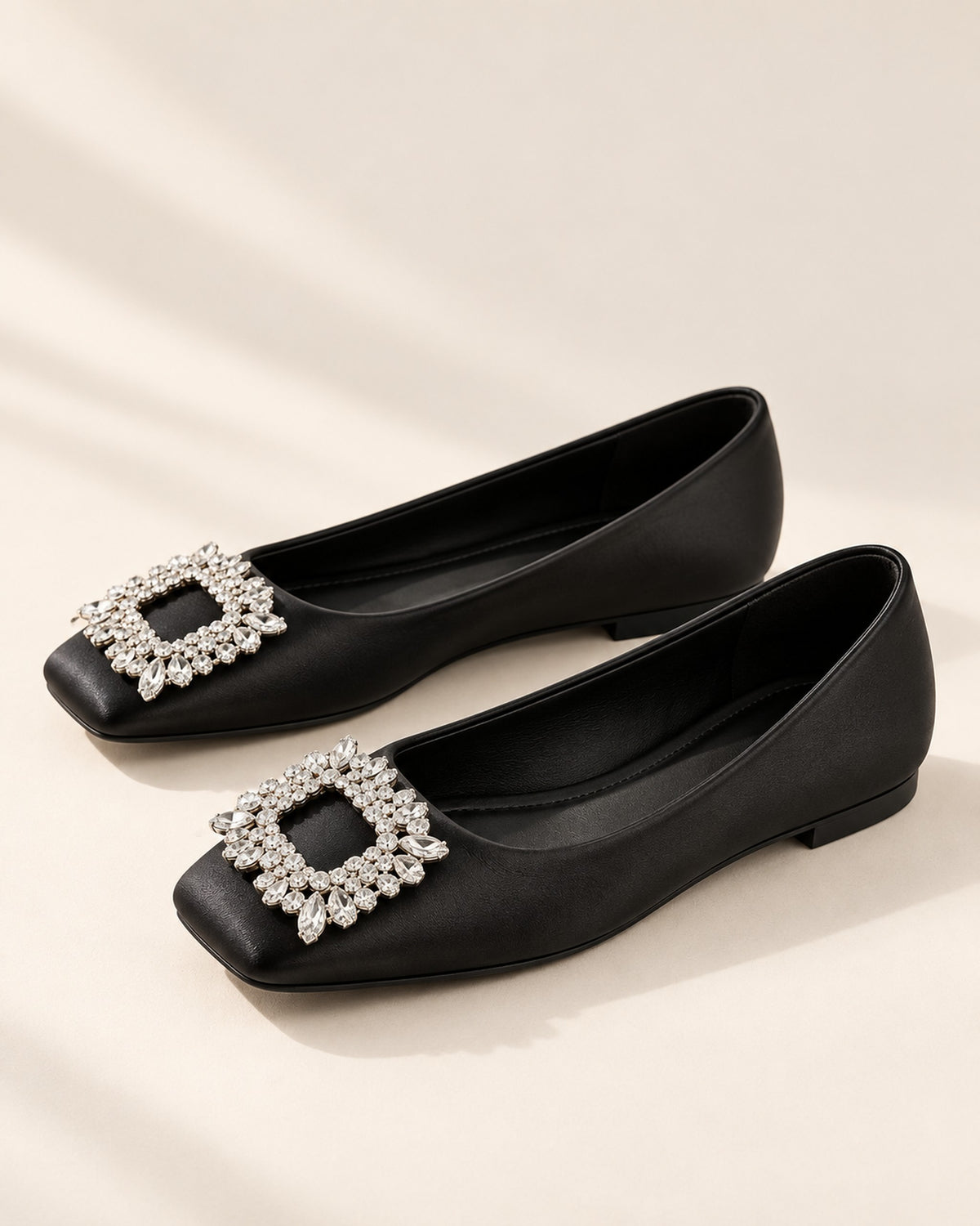 Lysiane square-toe flat with rhinestone buckle in Black, side view