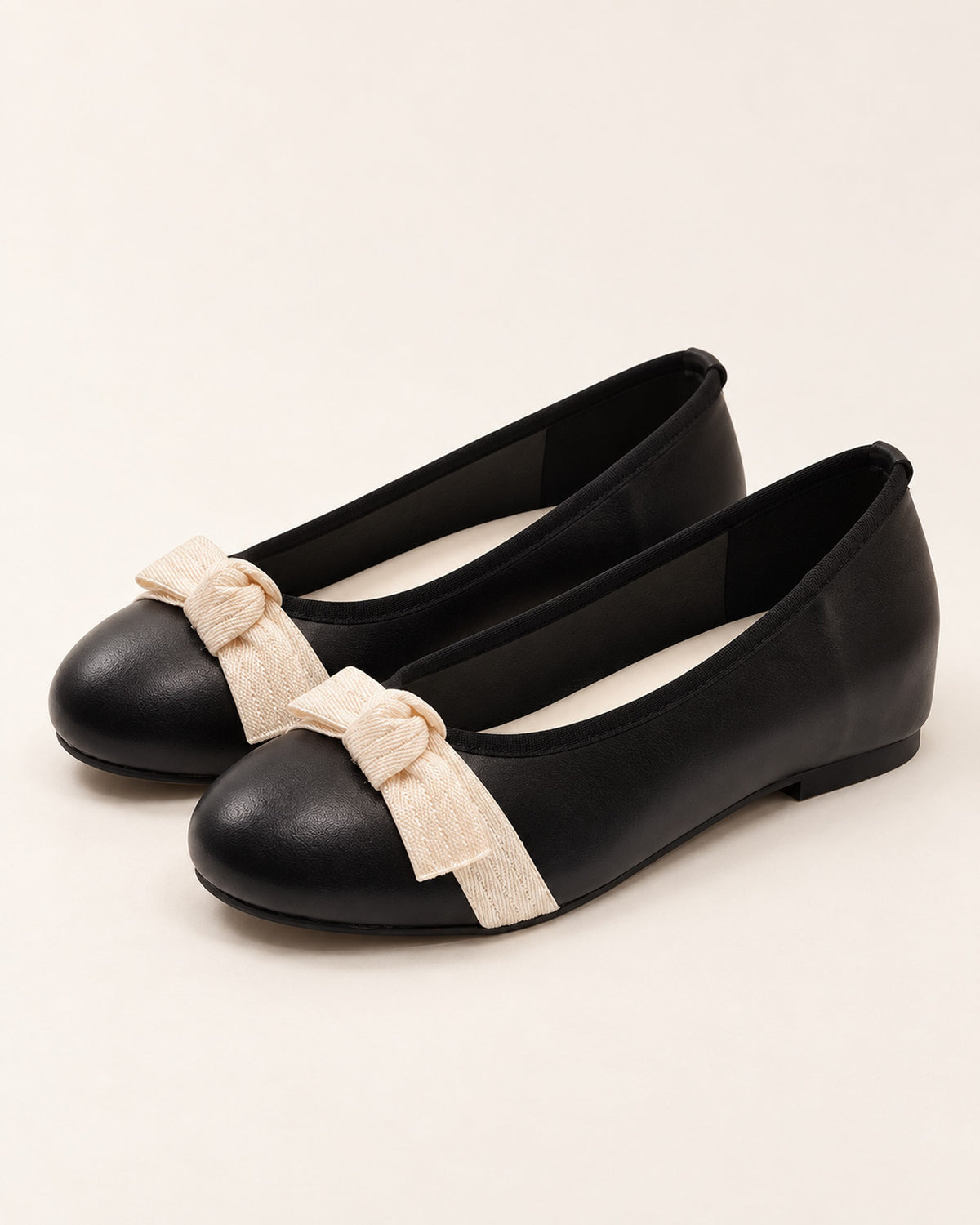 Mireille round-toe ballet flat with grosgrain bow in Black, three-quarter view