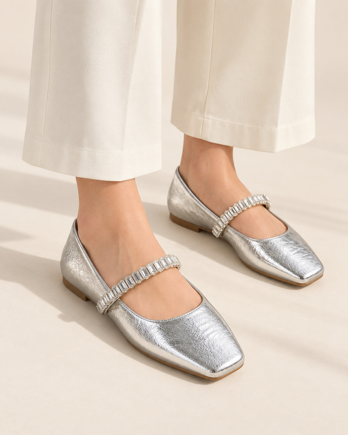 Noémie square-toe metallic ballet flat with rhinestone strap in Silver, worn