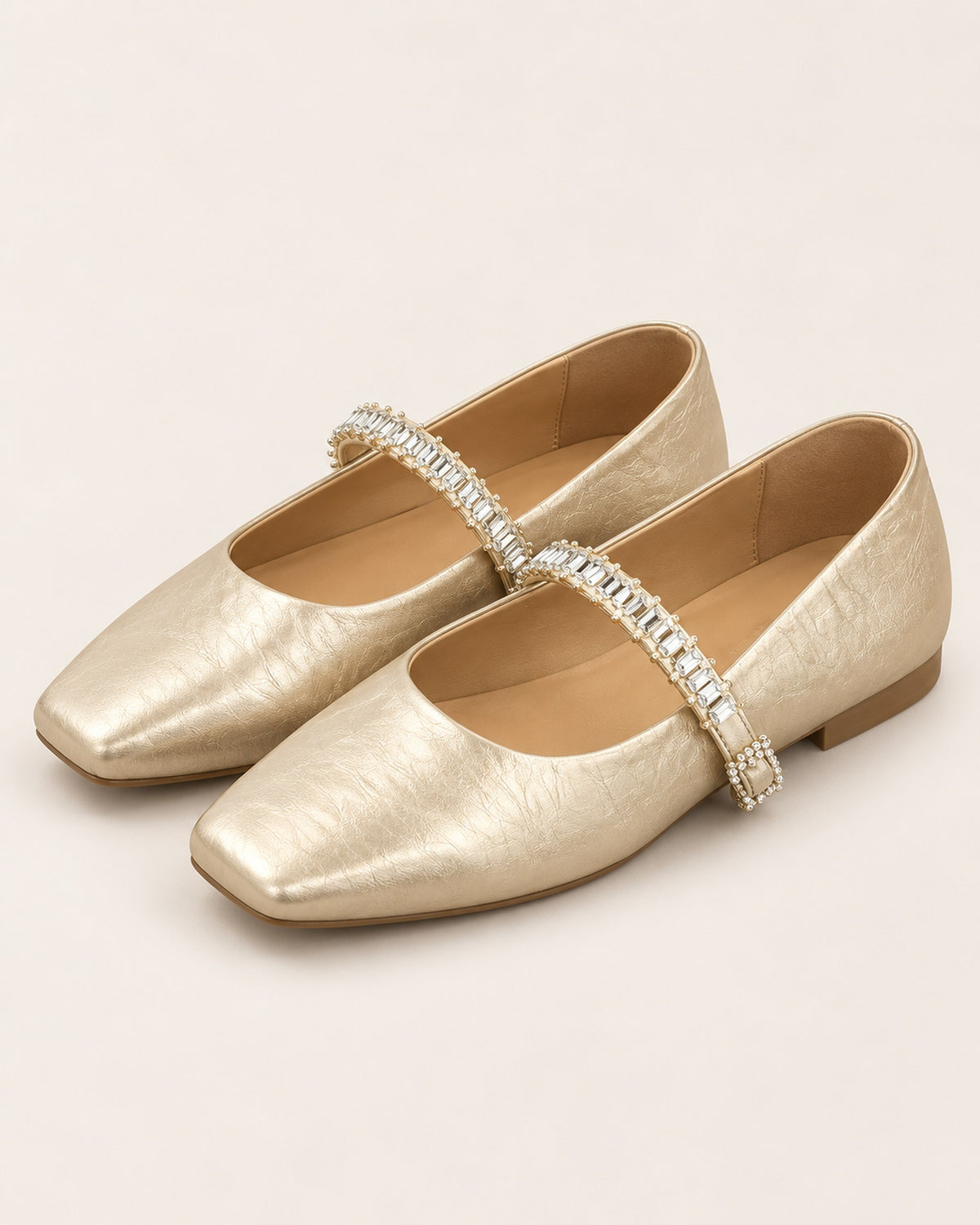 Noémie square-toe metallic ballet flat with rhinestone strap in Champagne, three-quarter view