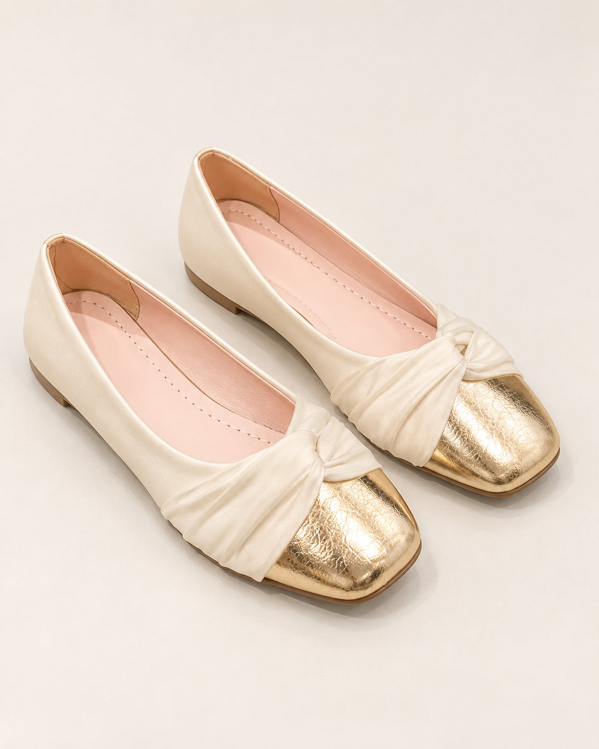 Élodie satin ballet flat with knotted vamp and metallic toe cap in Champagne, three-quarter view