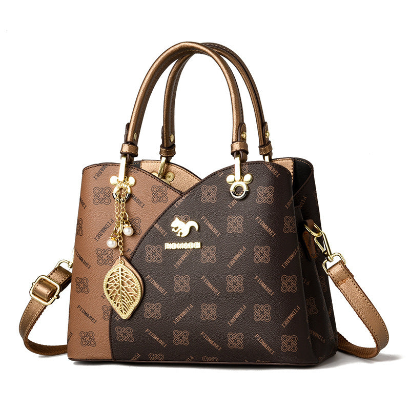 Isaline — Bolso Cruzado Estructurado Dorado