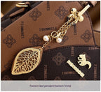 Isaline — Bolso Cruzado Estructurado Dorado